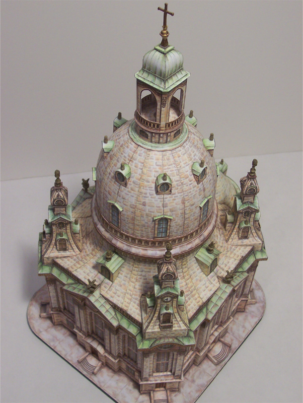 Frauenkirche Dresden (1/300 Schreiber Bogen)
This is a 1/300 paper model by Schreiber Bogen of the famous Frauenkirche Dresden (Church of Our Lady).  It was built by an engineer/architect/local genius named George Bahr in 1733 out of pure stone.  Even the gigantic bell is stone because copper covered wood was too expensive(!).  It caught fire in the 1945 Dresden firebombing.  Though it wasn’t hit directly, the firestorm consumed the interior furnishings sufficiently weakening the structural piers holding the church bell aloft until it finally collapsed two days later.  During the 45 year East German era the site stayed just as it had the day the last stone rolled to a rest.  After reunification, the church was completely rebuilt using the original plans and modern adaptations.  If you look at the modern façade it is pockmarked with original blackened stones from the original structure found at the site.  It’s an uniquely amazing building with an equally amazing history.
http://www.frauenkirche-dresden.de/zerstoerung+M5d637b1e38d.html
