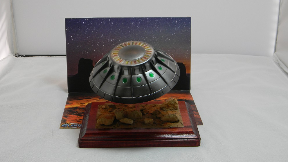 UFO Encounters Sighting Over Monument Valley (Atlantis)
The finish is Alclad Chrome, Polished Aluminum, Steel and Gold. The color work is all Tamiya clear acrylic colors. The base was done with Scultamold and rocks. The finish on the base is Tamiya acrylics and three different Mig pigments.
