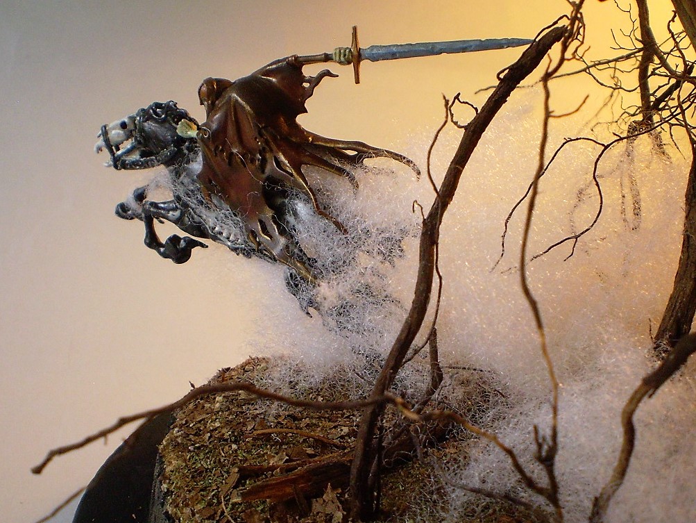 Dreadblade Harrow (Warhammer/Age of Sigmar 1/60)
This is a Warhammer/Age of Sigmar 1/60th scale Dreadblade Harrow. The   
fog is teased out batten from the fabric store with the 'trees' are   
actually roots from a dead Rosemary bush. (A victim of the great   
freeze of '21.)
