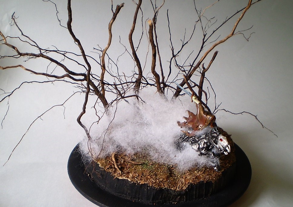 Dreadblade Harrow (Warhammer/Age of Sigmar 1/60)
This is a Warhammer/Age of Sigmar 1/60th scale Dreadblade Harrow. The   
fog is teased out batten from the fabric store with the 'trees' are   
actually roots from a dead Rosemary bush. (A victim of the great   
freeze of '21.)
