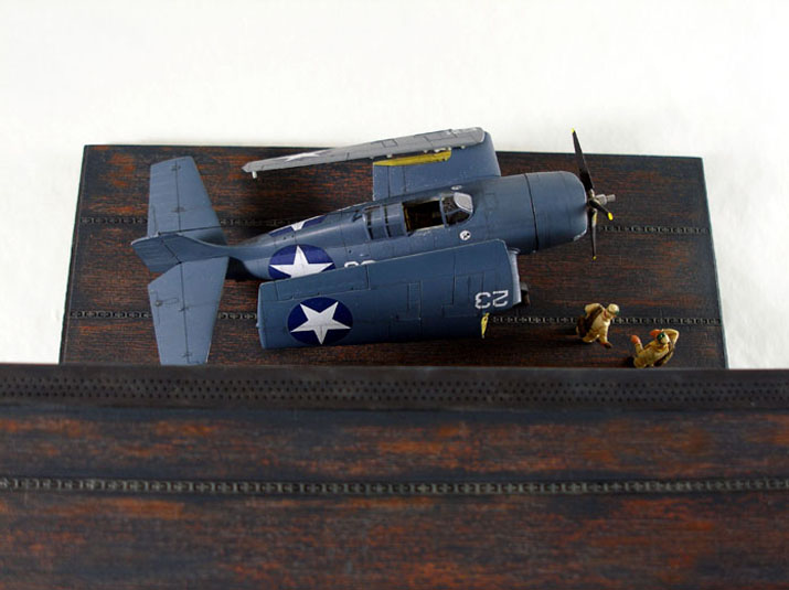 F4F-4 Wildcat (1/72 DML) 
I scratchbuilt the base with basswood and sheet styrene. The deck surfaces were DML items, and the resin figures were taken from CMK's WWII USN Pilots set.
