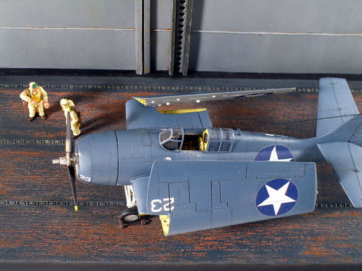 F4F-4 Wildcat (1/72 DML) 
I scratchbuilt the base with basswood and sheet styrene. The deck surfaces were DML items, and the resin figures were taken from CMK's WWII USN Pilots set.
