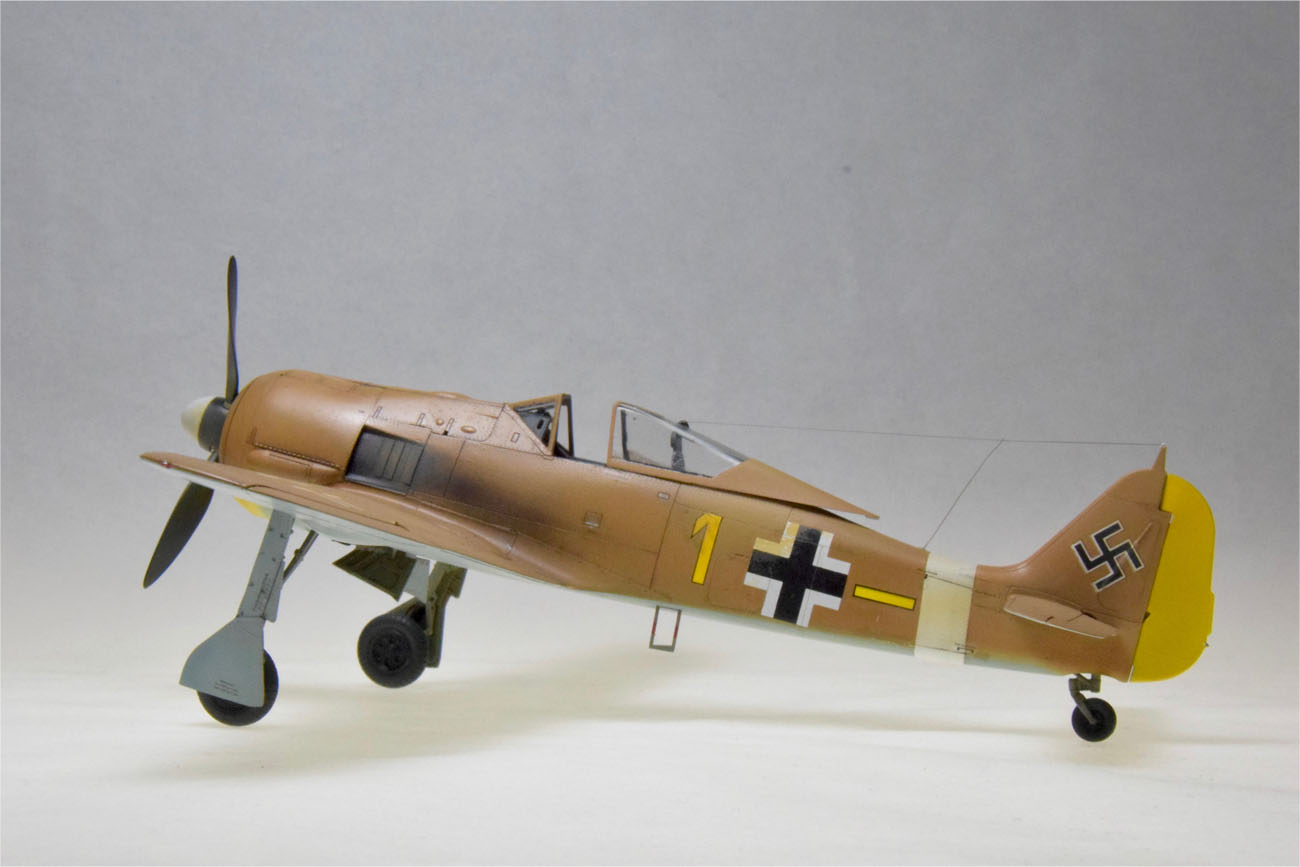 Fw-190A-4 (Eduard 1/48)
My Eduard Fw-190A4 just completed from an Overtree kit (No PE, no instructions, no decals; only plastic parts in a box.) Scrounged up the markings from friends and my scrap collection. Model represents an aircraft repainted to serve in Tunisia during the North African campaign by Lt. Erich Rudorfer of 6./JG2. 
