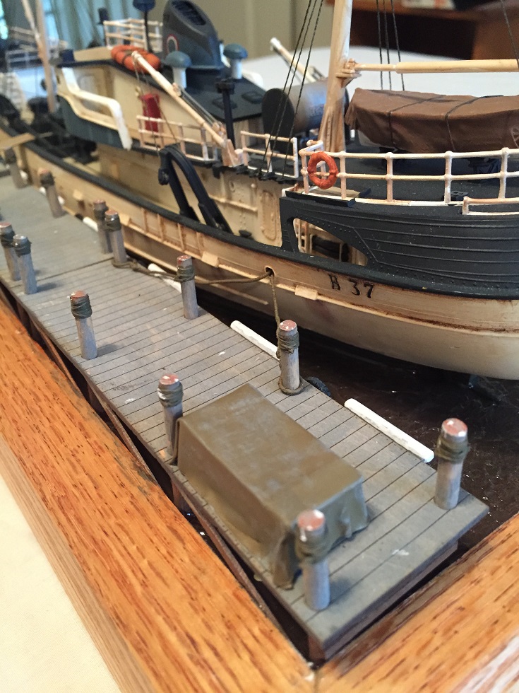 North Atlantic Fishing Trawler (Lindberg 1/90)
The Lindberg "North Atlantic Fishing Trawler" kit with HO Scale boat dock from Train Time Laser. Scratch built base, pilings, moorings. Water is Scenic Woodlands Realistic Water and Water Effects. 
