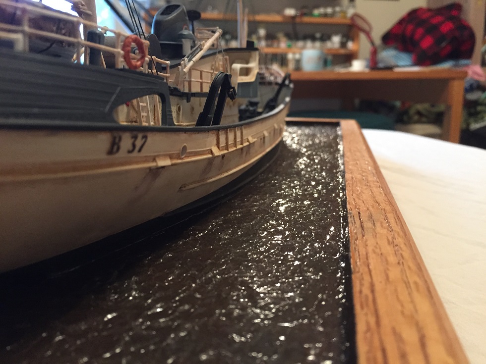 North Atlantic Fishing Trawler (Lindberg 1/90)
The Lindberg "North Atlantic Fishing Trawler" kit with HO Scale boat dock from Train Time Laser. Scratch built base, pilings, moorings. Water is Scenic Woodlands Realistic Water and Water Effects. 
