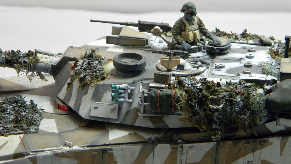 Marine M1A1 (Academy 1/35)
The color scheme is based on a real tank on exercises in Norway.
Camouflage netting all scratch. The figure is from MiniArt's Marine tank crew set.
