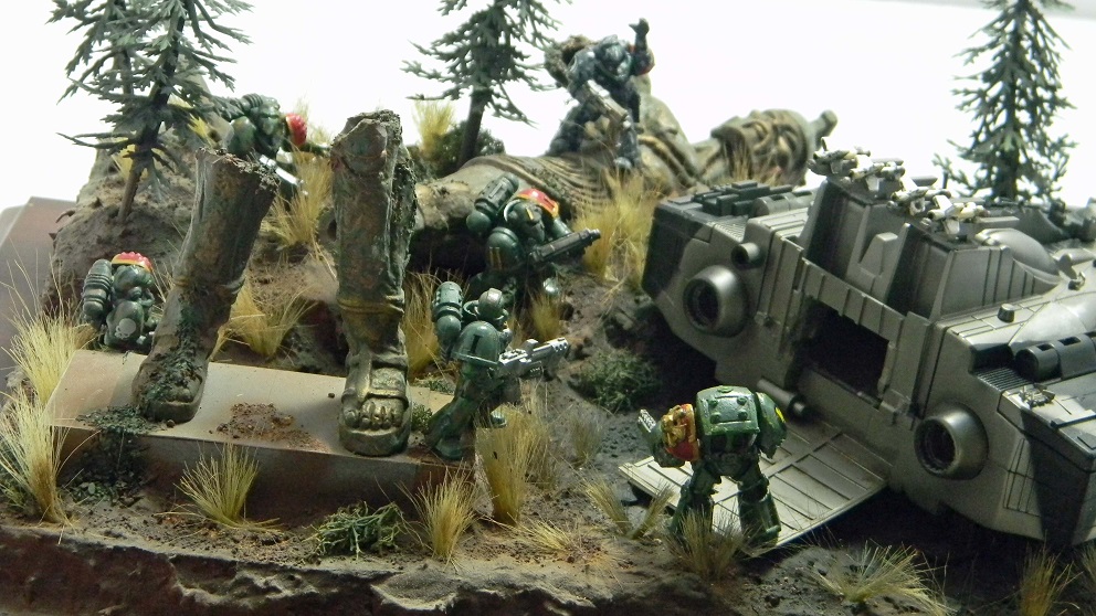 Space Marine Diorama. (Warhammer 40K 25mm)
The fallen statue is Talos from Jason and the Argonauts. The space craft is a toy rescued from somebody's trash. I added a lot from the parts box to the rescued toy.
