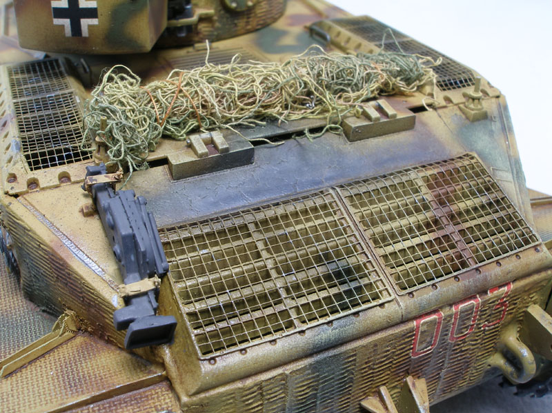 Tiger (P) of 653rd Schwere (heavy) Panzerjger Abteilung
DML 1/35 kit with Lion Roar PE set, Eduard barrel, and Friulmodel tracks. The zimmerit was done with Squadron putty using Karl Leidy's "Coke bottle cap" method.

