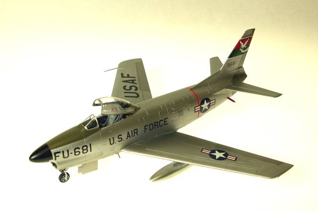 F-86L
1/48 Revell F86D with a Hasegawa F86F-40 wing creating the F86L, also identified by the (added detail) SAGE antenna at the left wing root. Eduard's F86 Sabredog photoetch set was used externally and internally, especially to replace the prototype instrument panel and its shroud; 330th FIS USAF; Alclad, Tamiya, Gunze, Model Master and Polly S paints; Cutting Edge and kit decals. The white tail art was reproduced as a decal by Milton Bell.
