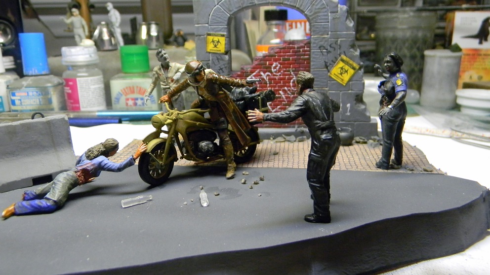 Zombie Killer
This is the Masterbox figure set. Lots of re-sculpting on the zombies. The figure is loosely based on the Resident Evil motorcycle rider. The building is an old Italaeri diorama piece.
