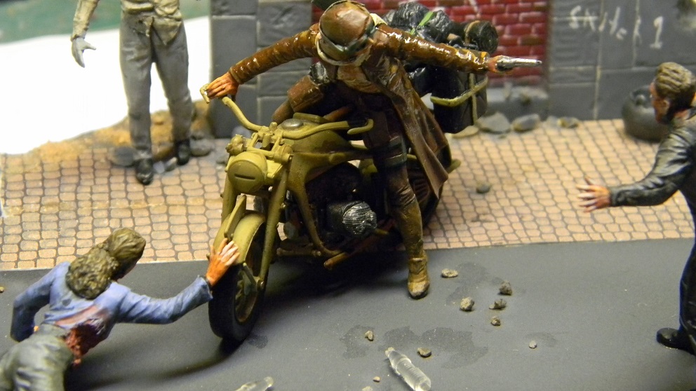 Zombie Killer
This is the Masterbox figure set. Lots of re-sculpting on the zombies. The figure is loosely based on the Resident Evil motorcycle rider. The building is an old Italaeri diorama piece.
