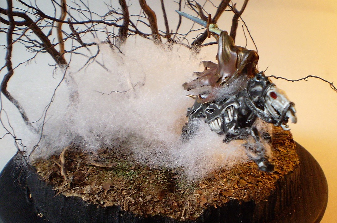 Dreadblade Harrow (Warhammer/Age of Sigmar 1/60)
This is a Warhammer/Age of Sigmar 1/60th scale Dreadblade Harrow. The   
fog is teased out batten from the fabric store with the 'trees' are   
actually roots from a dead Rosemary bush. (A victim of the great   
freeze of '21.)
