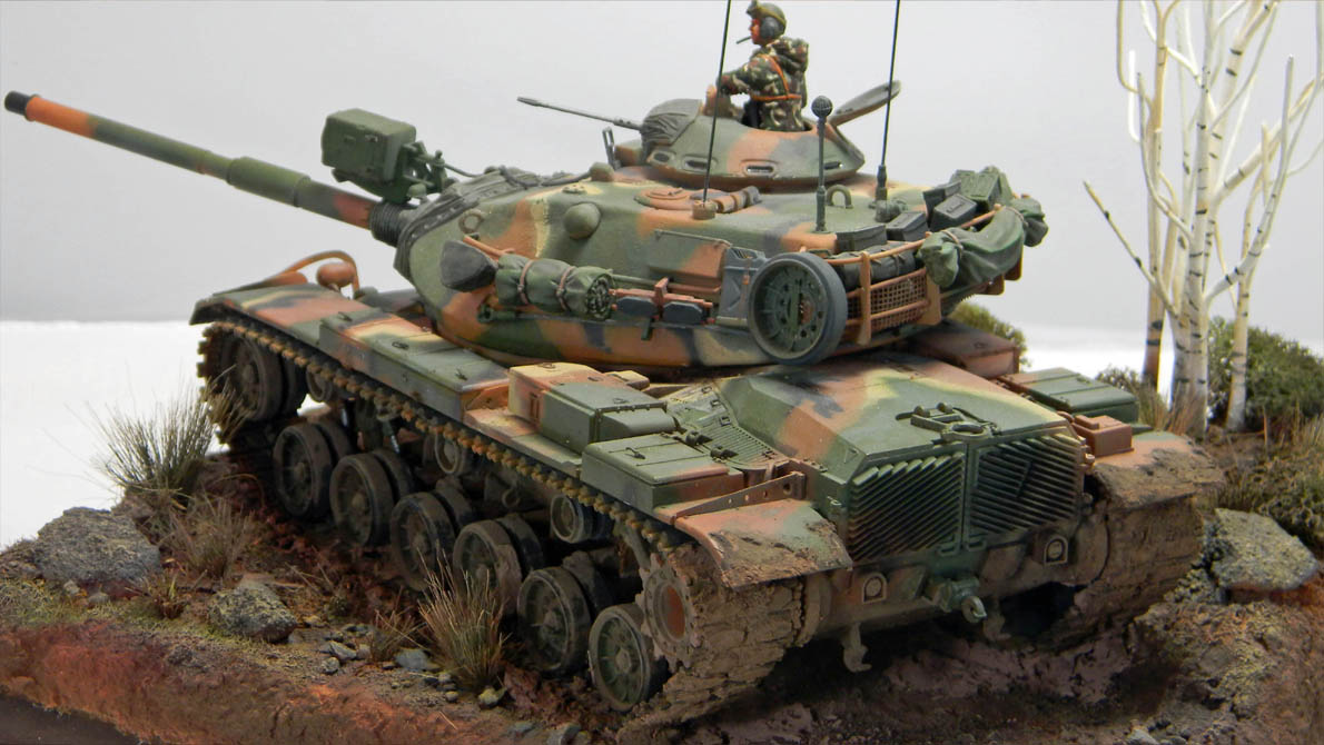 M60 A3 (DEF 1/35)
This is my build of the DEF m60 A3 kit. It's the Esci M60A1 kit with resin and photo etch to bring it up to the A3 standard.
I added a tow cable made out of picture wire and modified the spare track links to reflect the late style track.
The figure has a hood made out of AVES putty and I added a Hornet head. The base is Styrofoam, modeling clay and Sculptamold with Woodland scenic trees and bushes.
