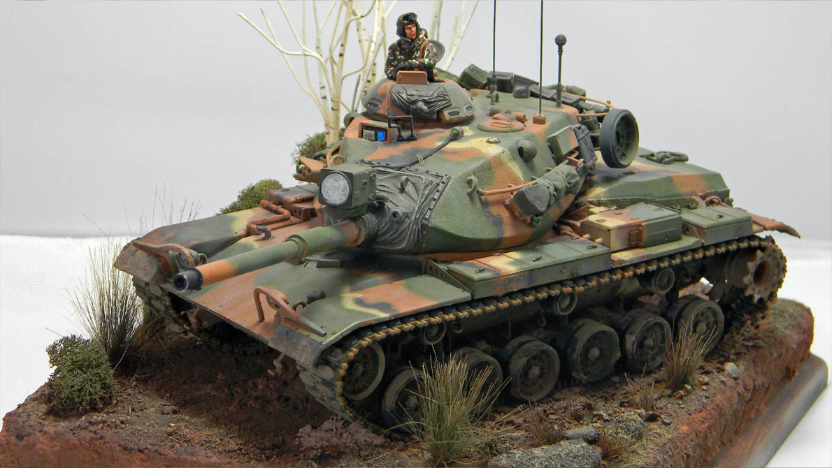 M60 A3 (DEF 1/35)
This is my build of the DEF m60 A3 kit. It's the Esci M60A1 kit with resin and photo etch to bring it up to the A3 standard.
I added a tow cable made out of picture wire and modified the spare track links to reflect the late style track.
The figure has a hood made out of AVES putty and I added a Hornet head. The base is Styrofoam, modeling clay and Sculptamold with Woodland scenic trees and bushes.
