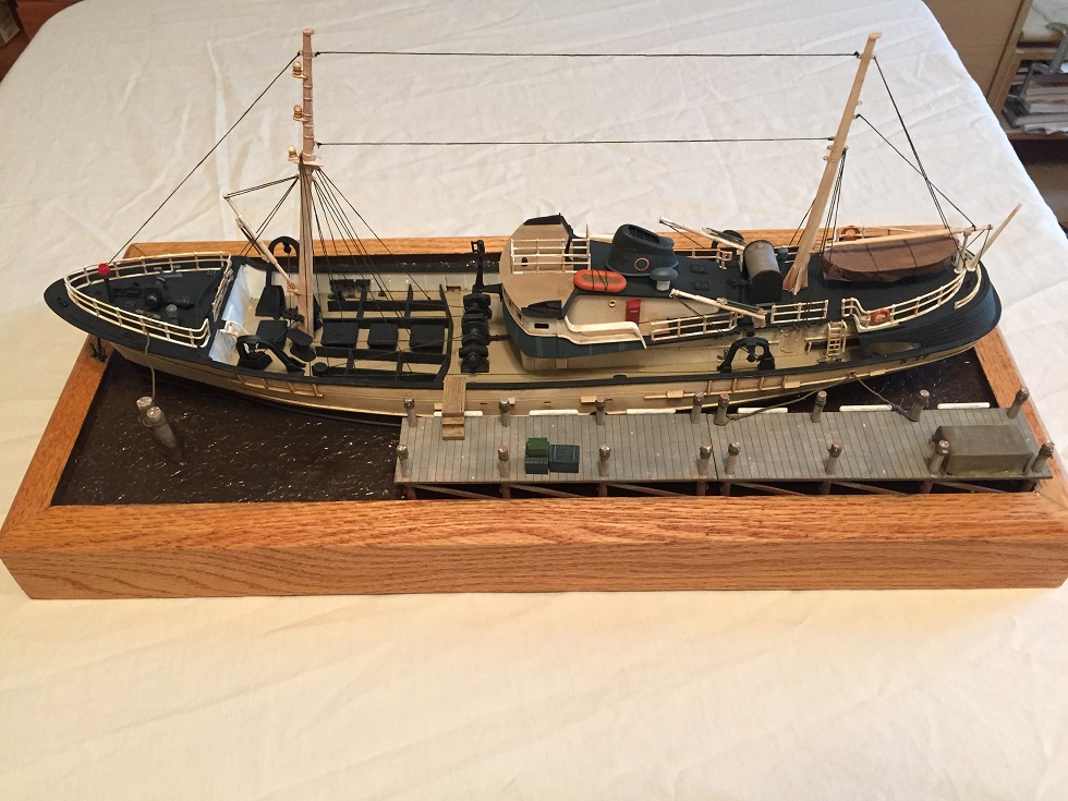 North Atlantic Fishing Trawler (Lindberg 1/90)
The Lindberg "North Atlantic Fishing Trawler" kit with HO Scale boat dock from Train Time Laser. Scratch built base, pilings, moorings. Water is Scenic Woodlands Realistic Water and Water Effects. 
