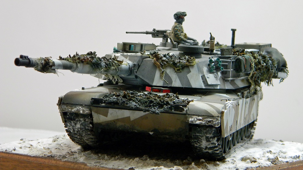 Marine M1A1 (Academy 1/35)
The color scheme is based on a real tank on exercises in Norway.
Camouflage netting all scratch. The figure is from MiniArt's Marine tank crew set.
