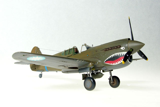 P-40
This is a P-40E from Hasegawa finished as Ed Rector's aircraft, one of the first "E" types supplied to the AVG as replacement aircraft.

[b][URL=http://www.austinsms.org/article2_06.php]Click here to read the feature article on this model.[/URL][/b]
