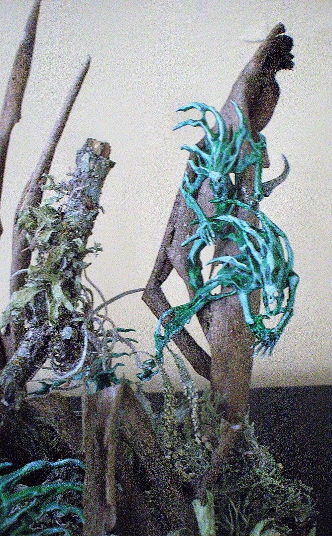 Spirit Hosts
These are Spirit Hosts from the Warhammer: Age of Sigmar series. The  
diorama is composed of lichen from pecan trees, bark from a crepe  
myrtle and the odd bit of ball moss. All from the yard. The base is  
florist foam covered in pre- colored tile grout.

