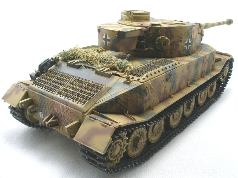 Tiger (P) of 653rd Schwere (heavy) Panzerjger Abteilung
DML 1/35 kit with Lion Roar PE set, Eduard barrel, and Friulmodel tracks. The zimmerit was done with Squadron putty using Karl Leidy's "Coke bottle cap" method.
