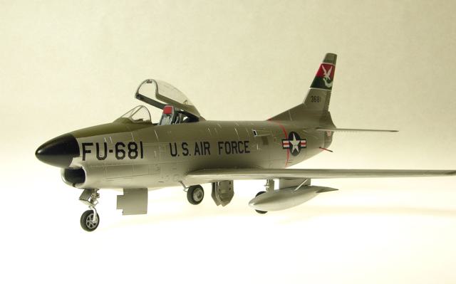 F-86L
1/48 Revell F86D with a Hasegawa F86F-40 wing creating the F86L, also identified by the (added detail) SAGE antenna at the left wing root. Eduard's F86 Sabredog photoetch set was used externally and internally, especially to replace the prototype instrument panel and its shroud; 330th FIS USAF; Alclad, Tamiya, Gunze, Model Master and Polly S paints; Cutting Edge and kit decals. The white tail art was reproduced as a decal by Milton Bell.
