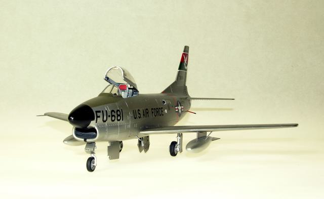 F-86L
1/48 Revell F86D with a Hasegawa F86F-40 wing creating the F86L, also identified by the (added detail) SAGE antenna at the left wing root. Eduard's F86 Sabredog photoetch set was used externally and internally, especially to replace the prototype instrument panel and its shroud; 330th FIS USAF; Alclad, Tamiya, Gunze, Model Master and Polly S paints; Cutting Edge and kit decals. The white tail art was reproduced as a decal by Milton Bell.
