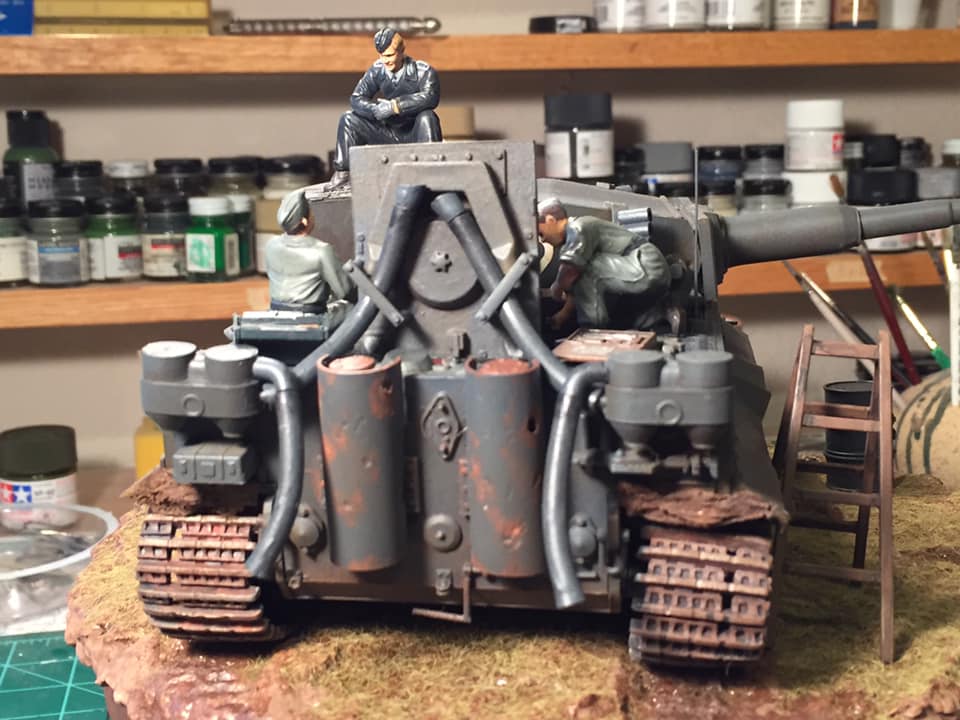 Tiger 1 (Tamiya 1/35)
Tiger 1, 503 Heavy Panzer Battalion, Russia, Spring 1943

This was my refurbish of a Tiger that had been sitting on my shelf since I built it in high school. It was actually my first 1/35 armor kit. Added the engine and figures from the Tamiya Engine Crew Set. Scratch built the exhaust covers and added a few other small details along with lots of mud. The crewman is from yet another Tamiya set. New paint, new decals, the works. Cleaned up pretty good for a model I competed 30 years ago.
